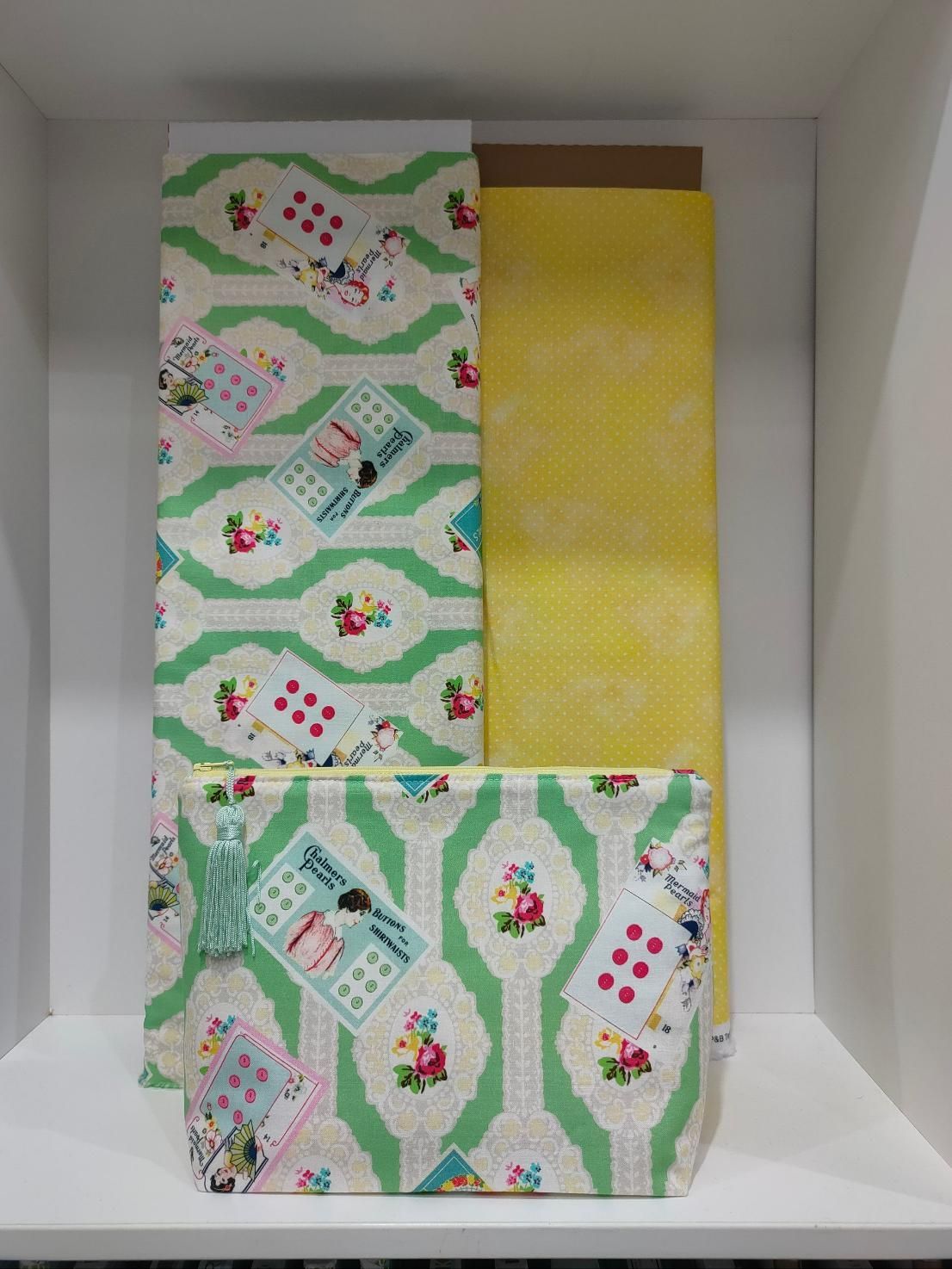 A White Shelf with A Green and Yellow Fabric on It — Stitch 2340 In Armidale, NSW
