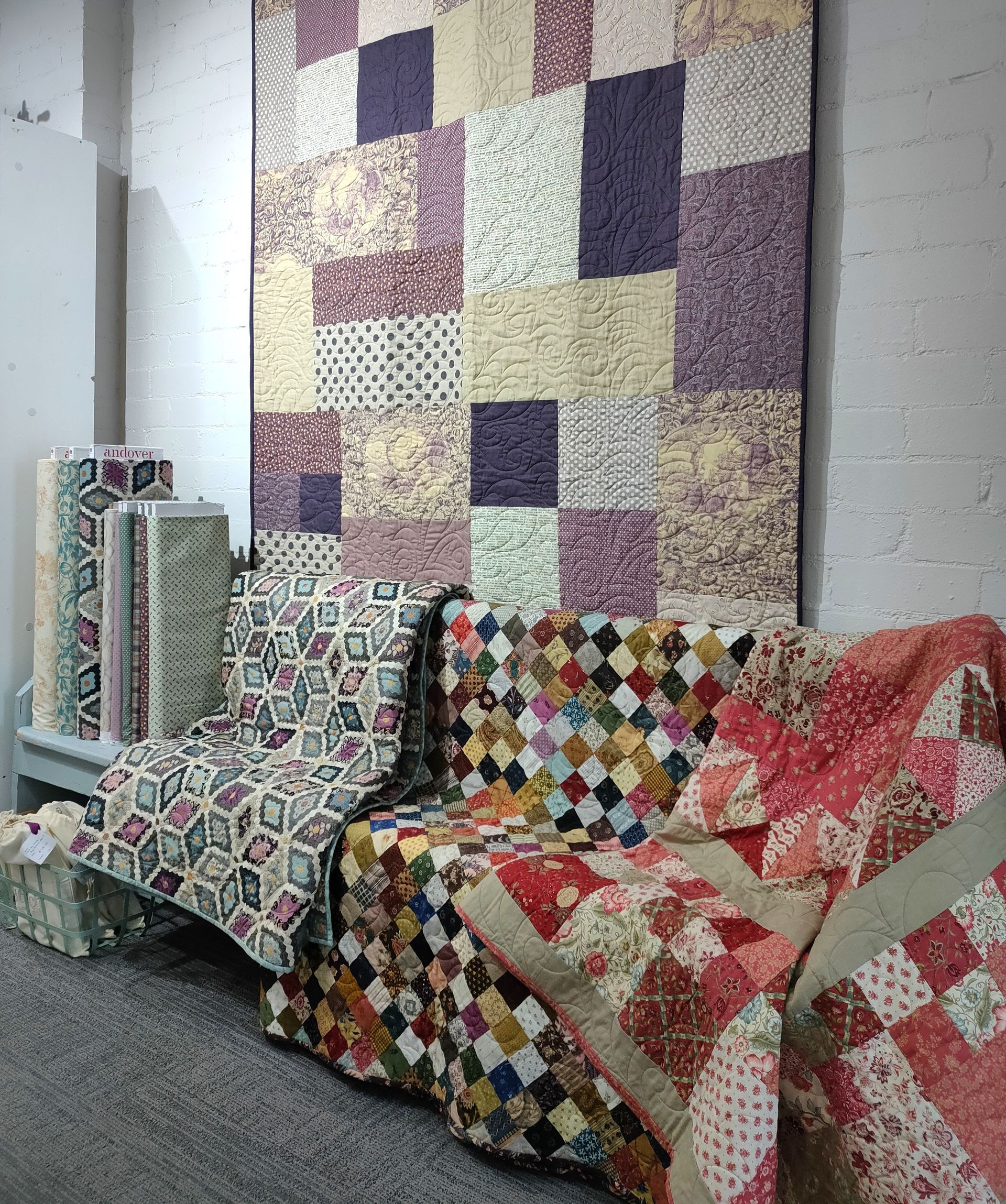 A Room Filled with Lots of Colorful Quilts and A Couch — Stitch 2340 In Tamworth, NSW