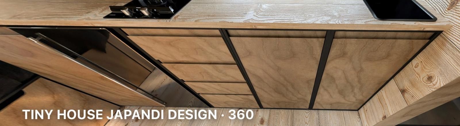 Wooden cabinet drawers with metal supports in a tiny house kitchen.