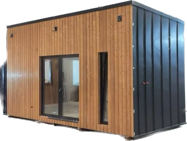 Modern cabin with wood siding and a black metal side; glass door.