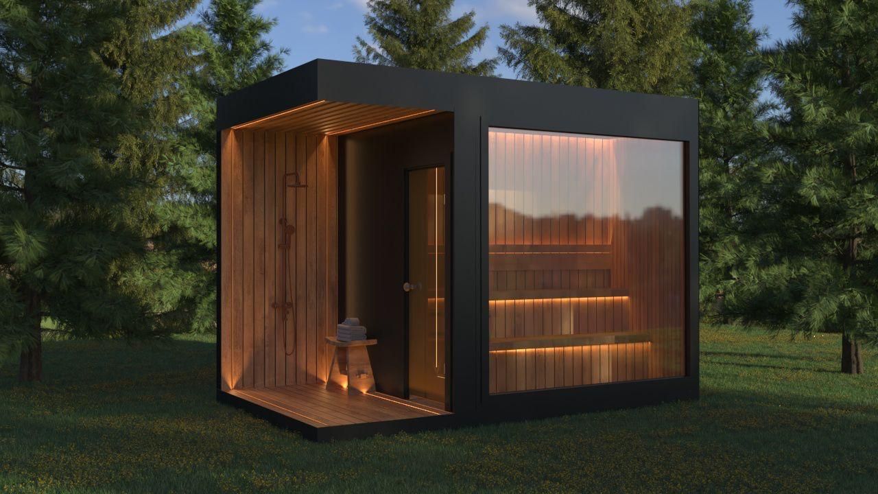 Modern black cabin with wooden interior and glass wall, set in a forest.