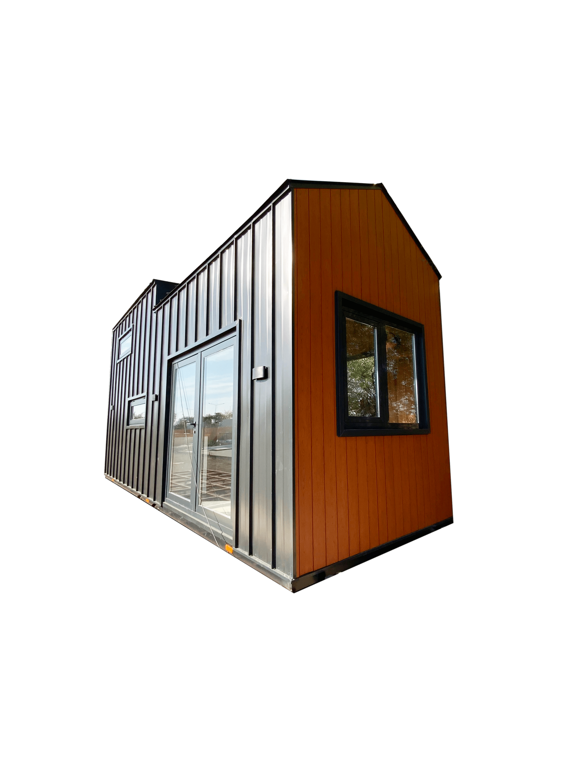 Tiny house with a zebra-striped section, silver siding, and a brown gable with a black-framed window.