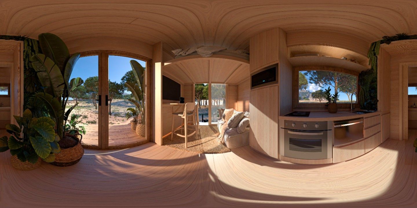 Interior of a wooden cabin with large windows and a view of outdoor desert scenery.