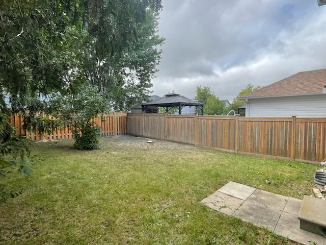 An after picture of a backyard cleaned up
