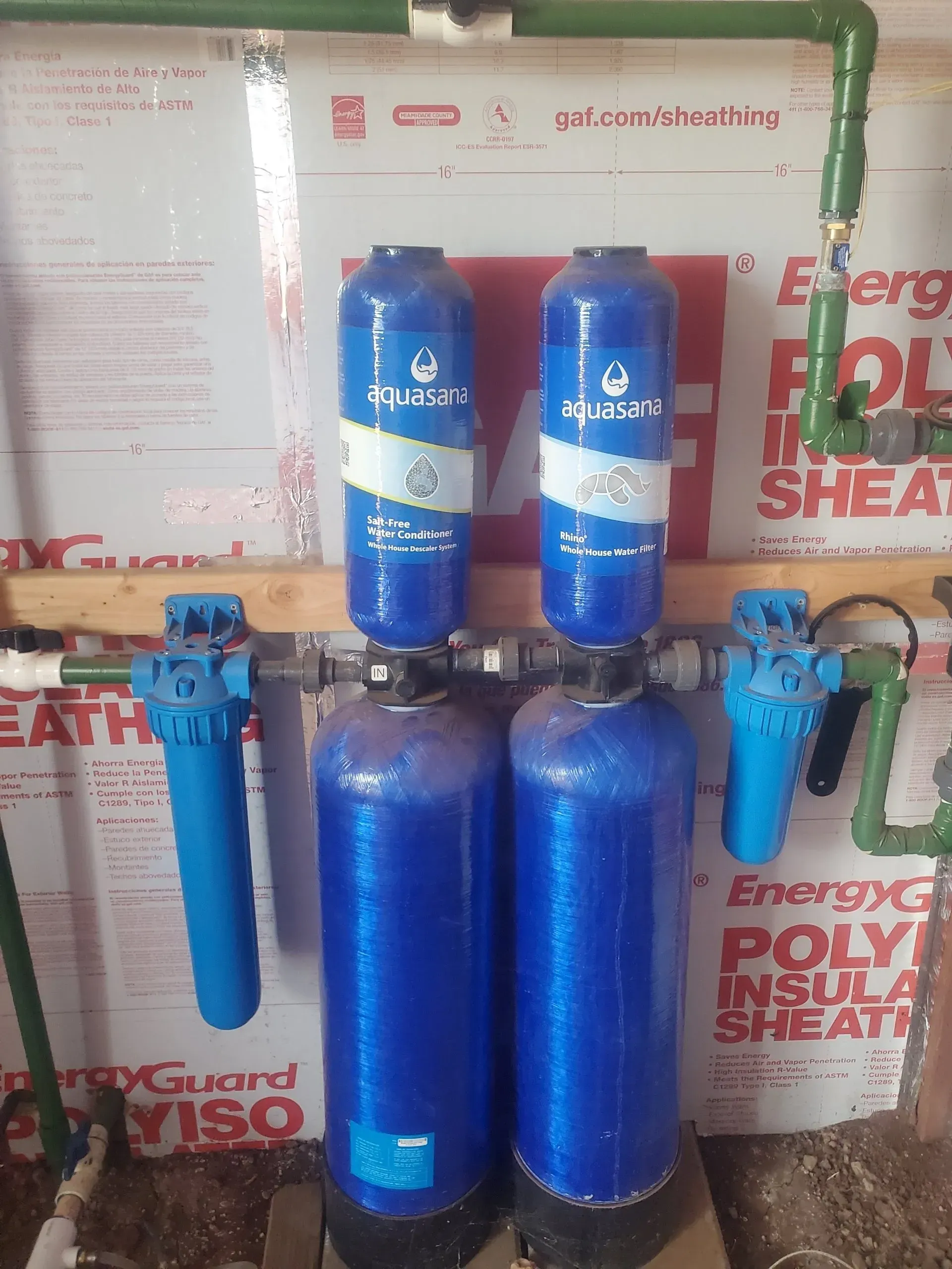 two blue bottles are sitting next to each other on a table .