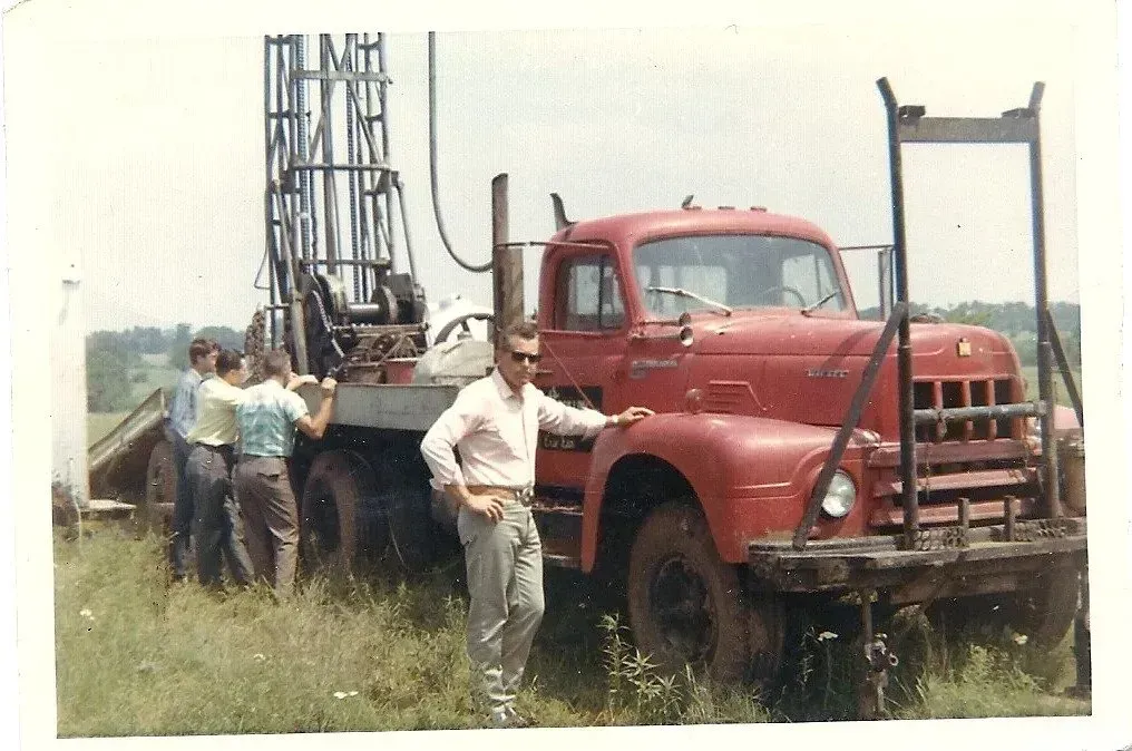 a triple l pump truck is parked in a field