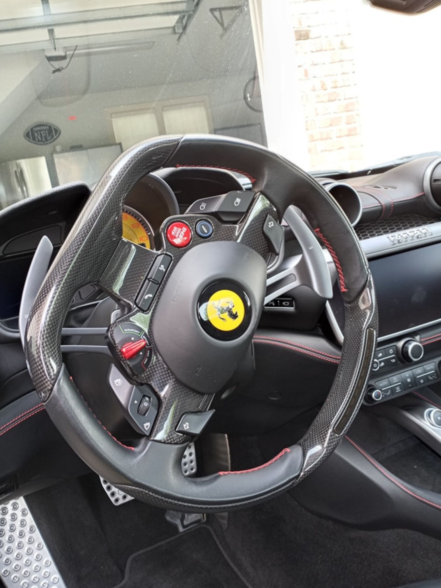 A close up of a steering wheel in a car