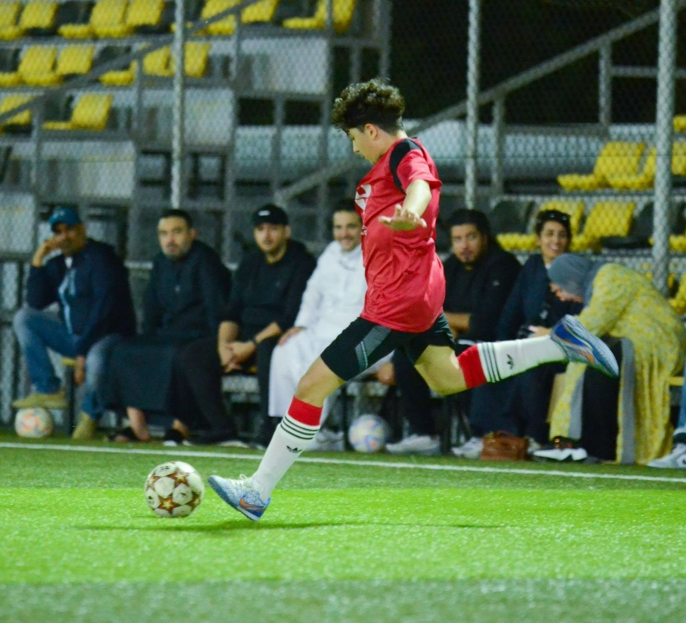 JU football player about to score a goal