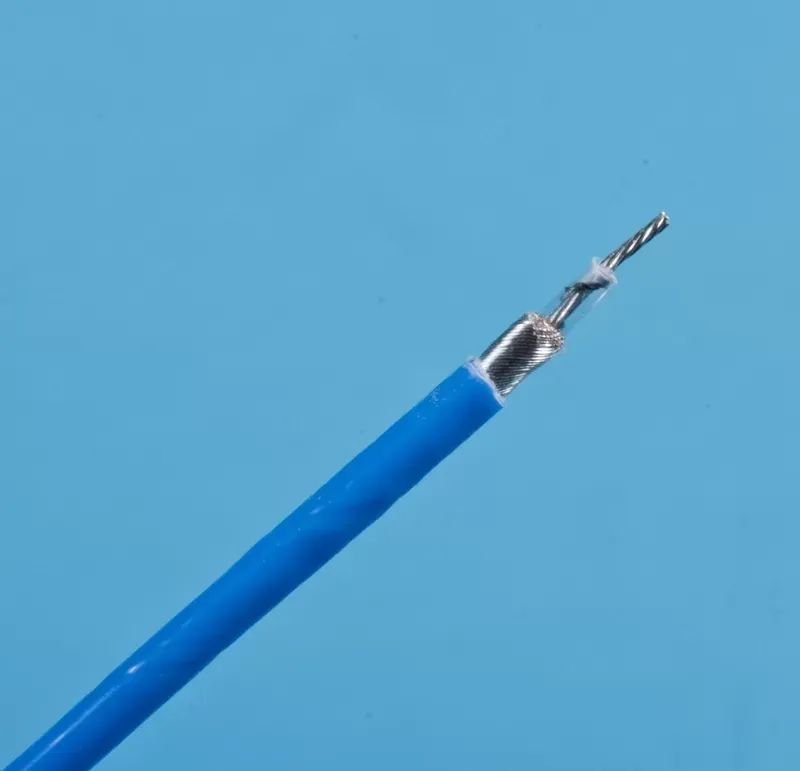 A blue shielded electrical cable with its outer insulation stripped back to reveal the internal braided metal shielding.
