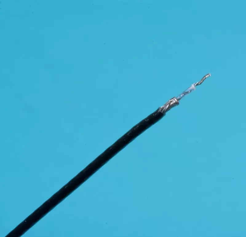 A single black-insulated wire with its tip stripped to expose the twisted silver-colored metal strands against a blue background.