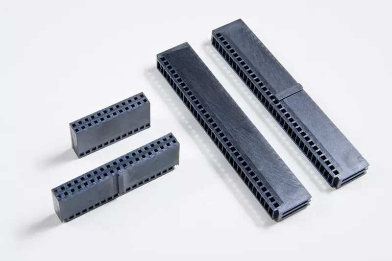 Four gray, rectangular multi-pin electronic header connectors of varying lengths arranged on a white background.