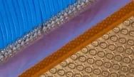 Close-up of a blue, ridged surface next to a purple strip and a beige textured mat with small, repeating circles.