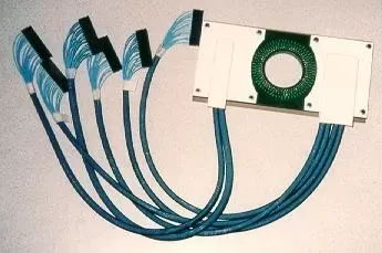A circular circuit board assembly with a white frame, connected by five blue cable bundles to individual black connectors.