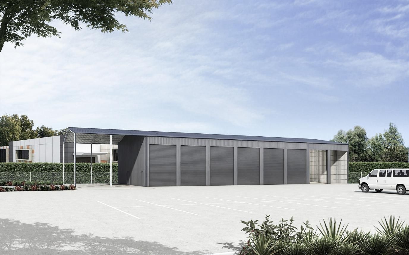 A White Van Is Parked in Front of A Large Building — Clearspan Builders In Queanbeyan East, NSW