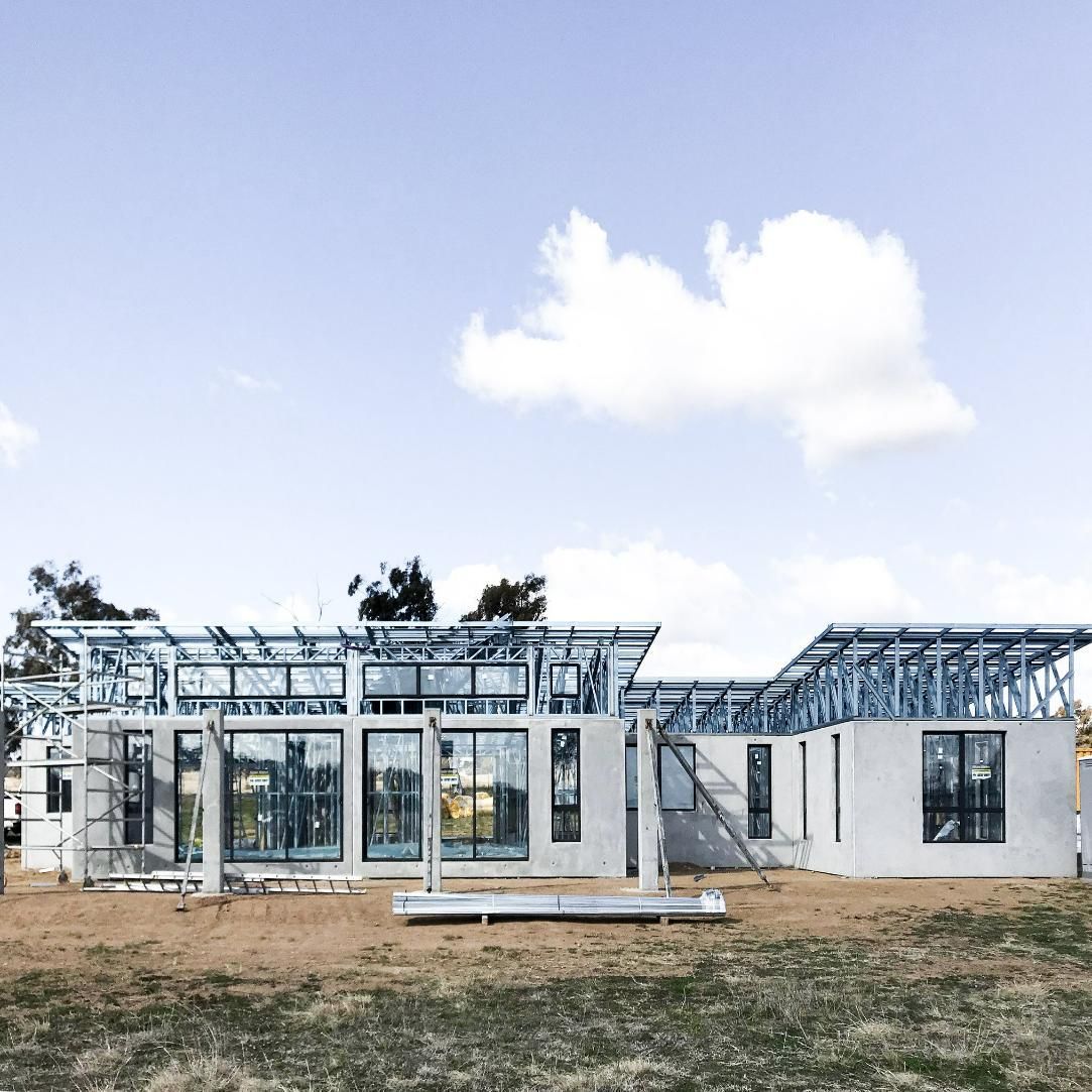 House Is Being Built in A Field with A Blue Sky in The Background — Clearspan Builders In Queanbeyan  East, NSW