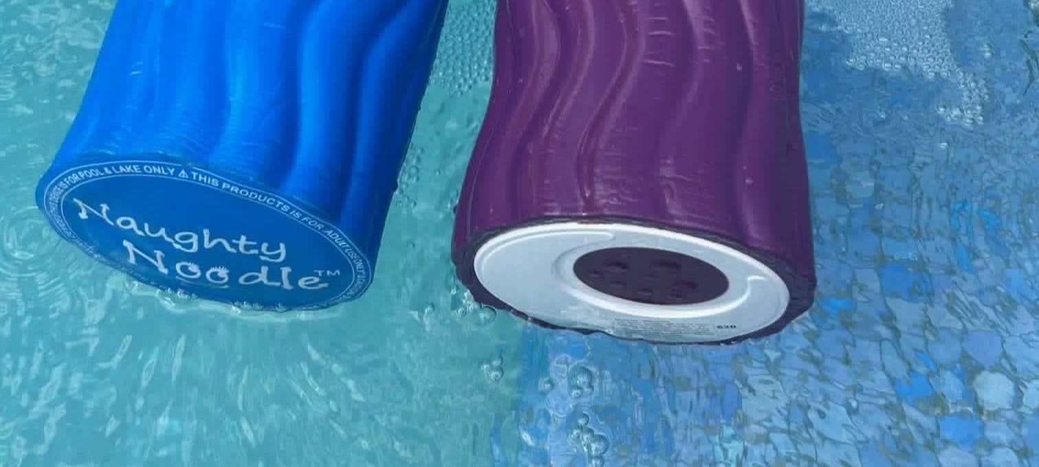 Two inflatable pool floats, one blue and one purple, floating in water