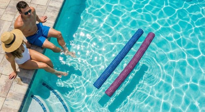 Two people sit by a pool with blue and pink lane noodles floating in clear water.