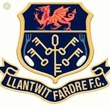 Llantwit Fardre F.C. crest: Red dragon above keys on navy shield, gold trim, banner reads