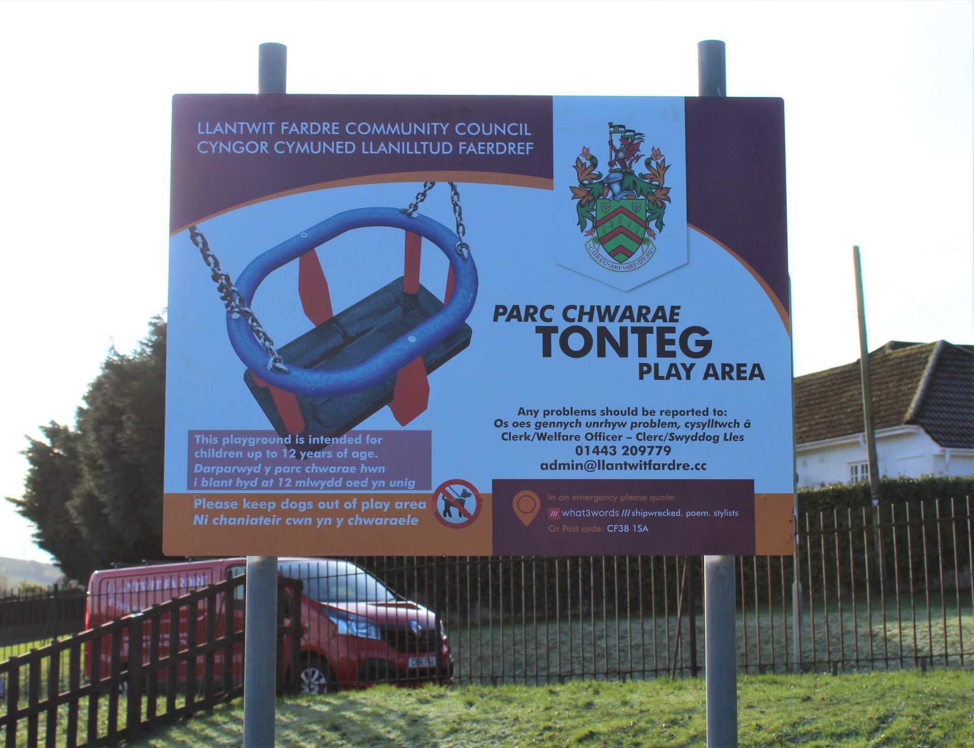 Sign for Tonteg Play Area by Llantwit Fardre Community Council with a swing set graphic.