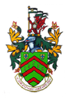 Coat of arms: green shield with red chevrons, crest with a red dragon, flag, motto.