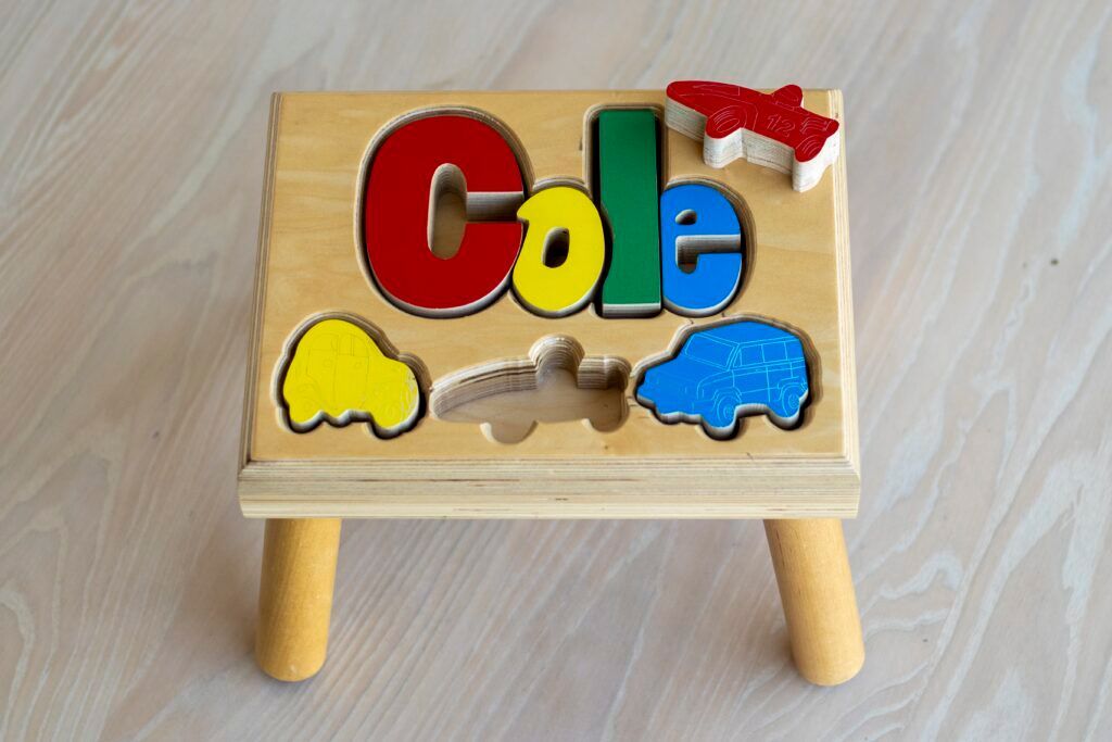 Puzzle name stool with