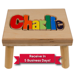 Wooden children's stool with colorful name “Charlie” and a red banner reading “Receive In 5 Business Days!”