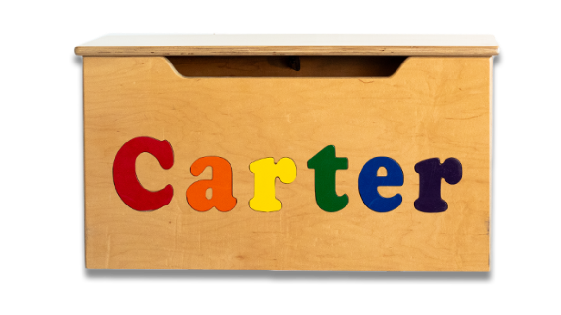 Wooden name toy chese labeled “Carter” with colorful letters on the front
