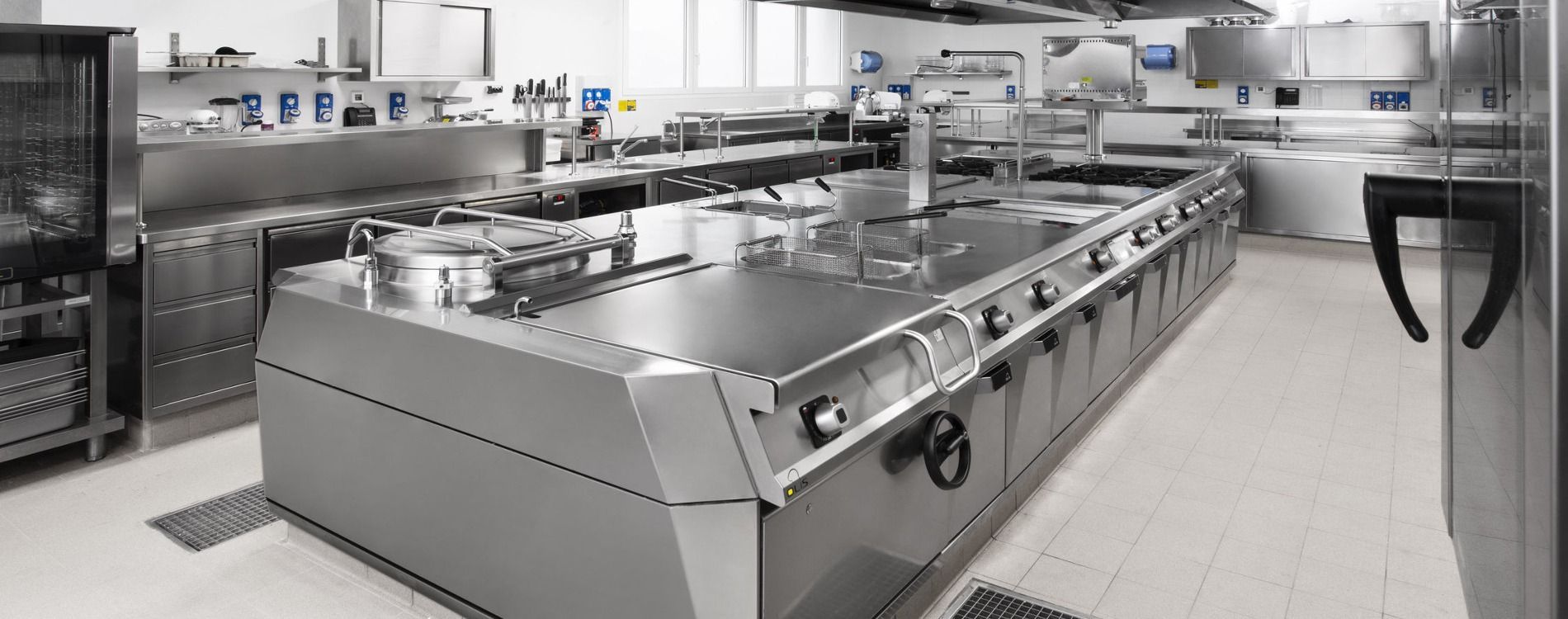 A Commercial Kitchen With Stainless Steel Appliances — Central Coast Commercial Kitchen Cleaning in Tuggerah, NSW