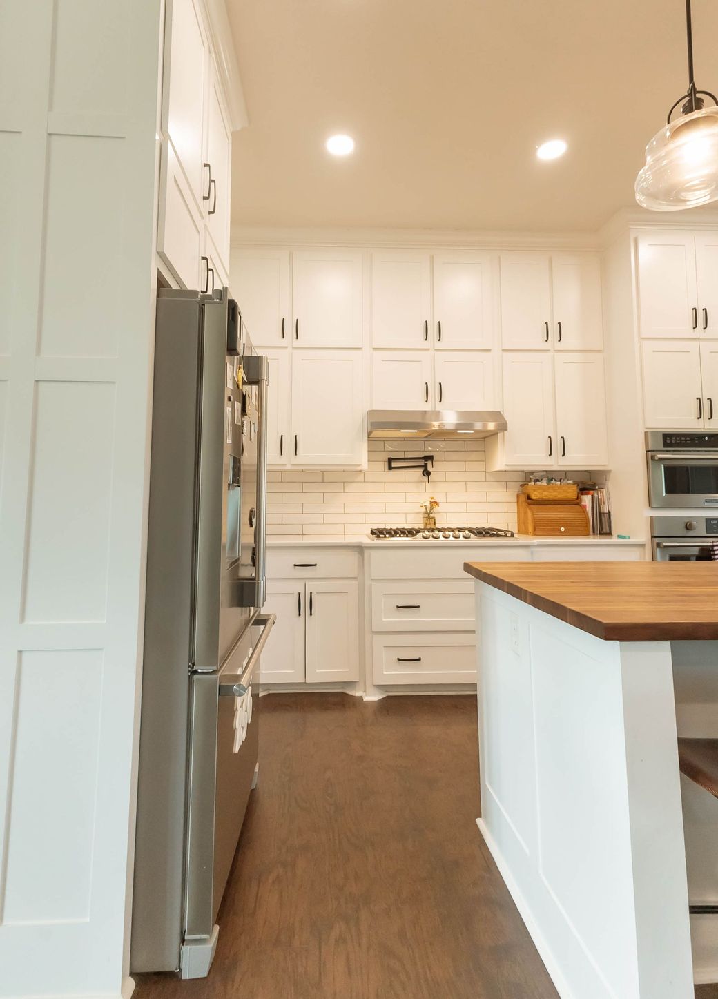New kitchen with white cabinets and gold handles