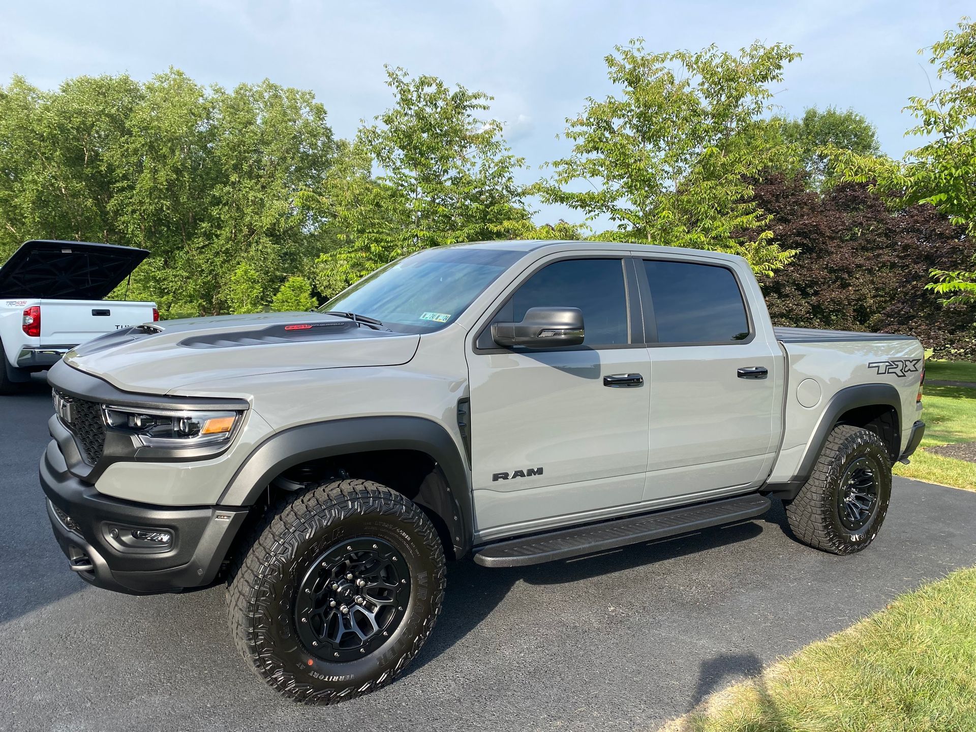 Gray RAM TRX pickup truck parked on a paved surface, with black wheels and tinted windows.