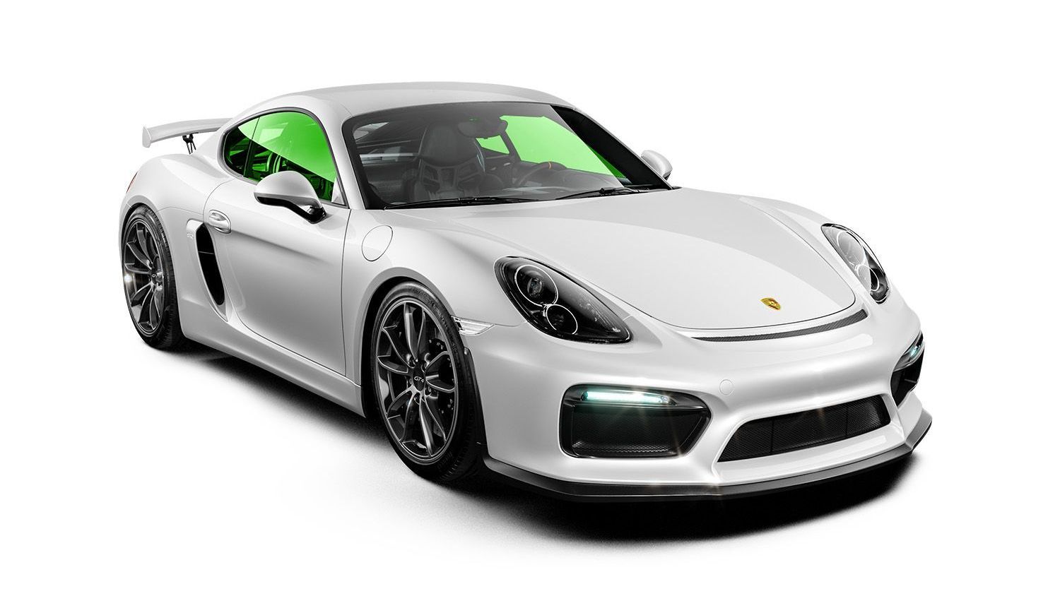 White Porsche sports car with black wheels and green tinted windows.