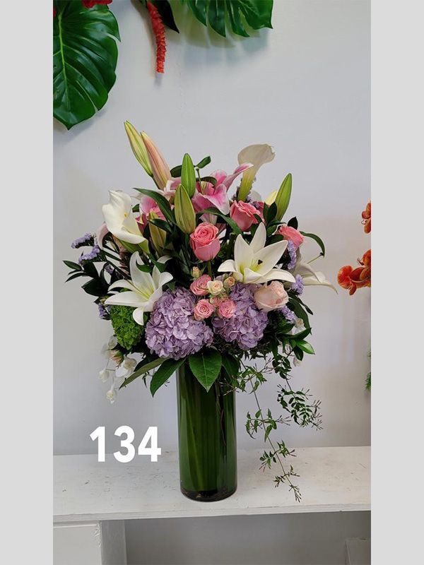 A vase filled with flowers is sitting on a table.