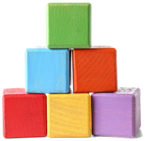 Stack of colorful wooden blocks in a pyramid: green, blue, orange, red, yellow, and purple.