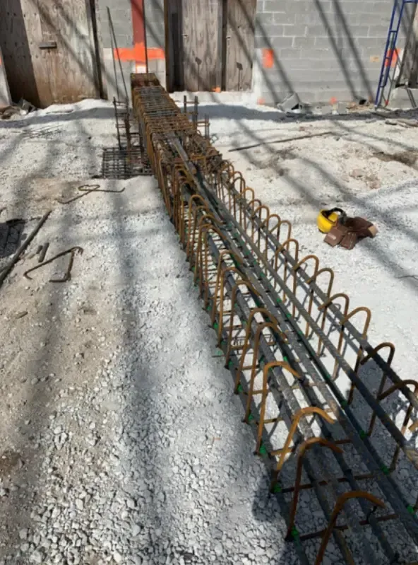 Reinforced steel bars prepared for concrete pouring at a construction site.