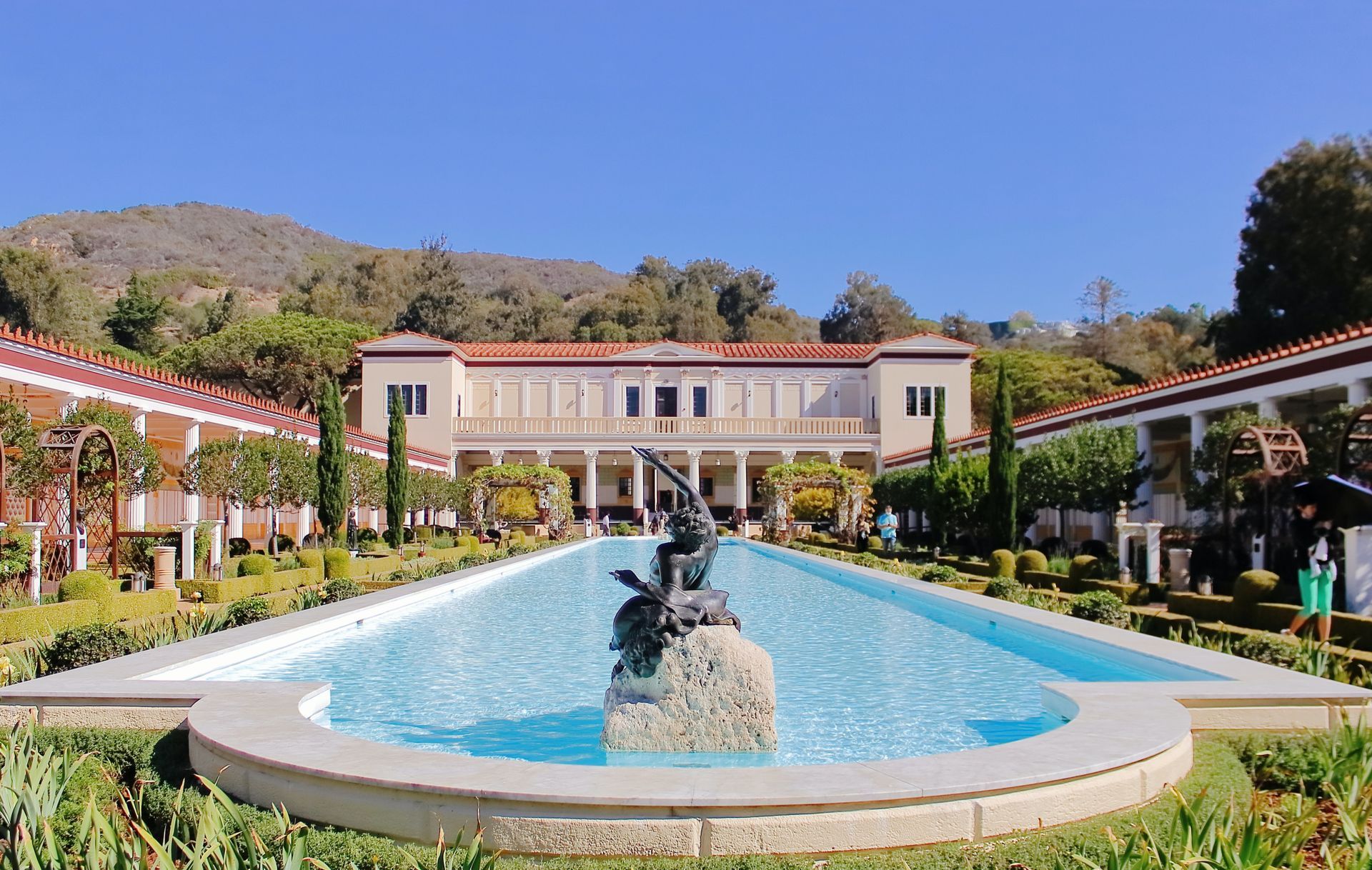 A large building with a fountain in front of it