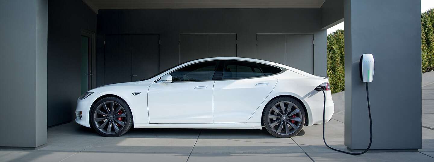 A White Tesla Model S Is Being Charged in A Garage — Solar Blessing in Stanthorpe, QLD