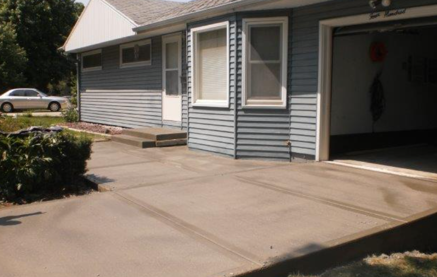 a house with a car parked in front of it