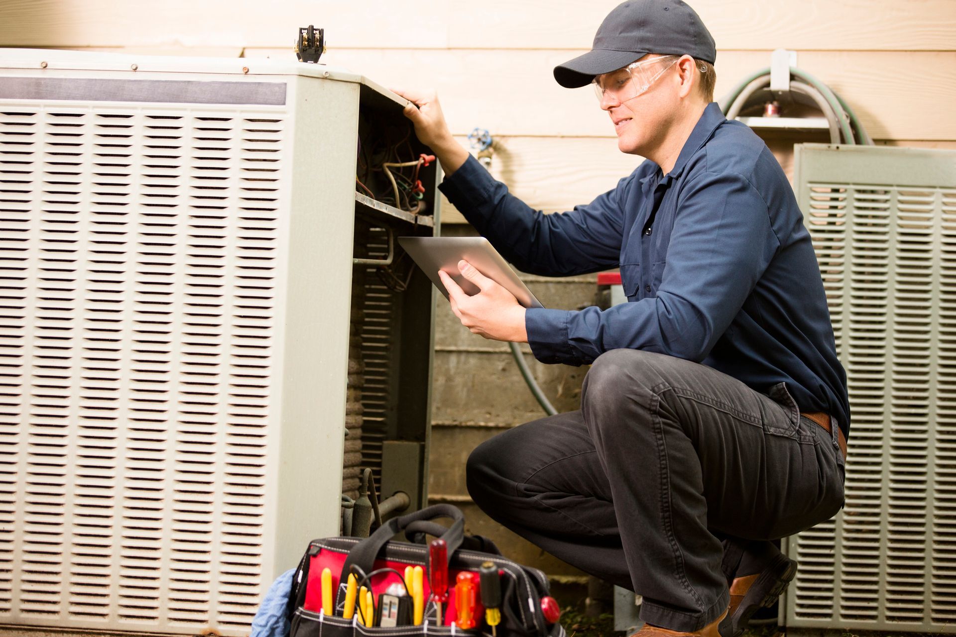 Man Installing Gas Boiler — Kansas City, MO — JLH Mechanical Inc.