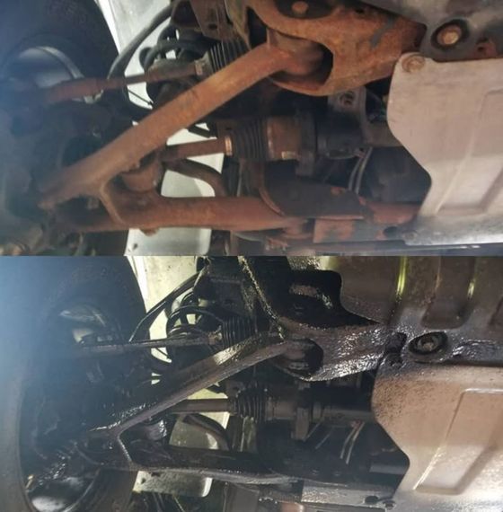 Undercarriage of a vehicle with rusted parts above and a cleaner, black-coated view below