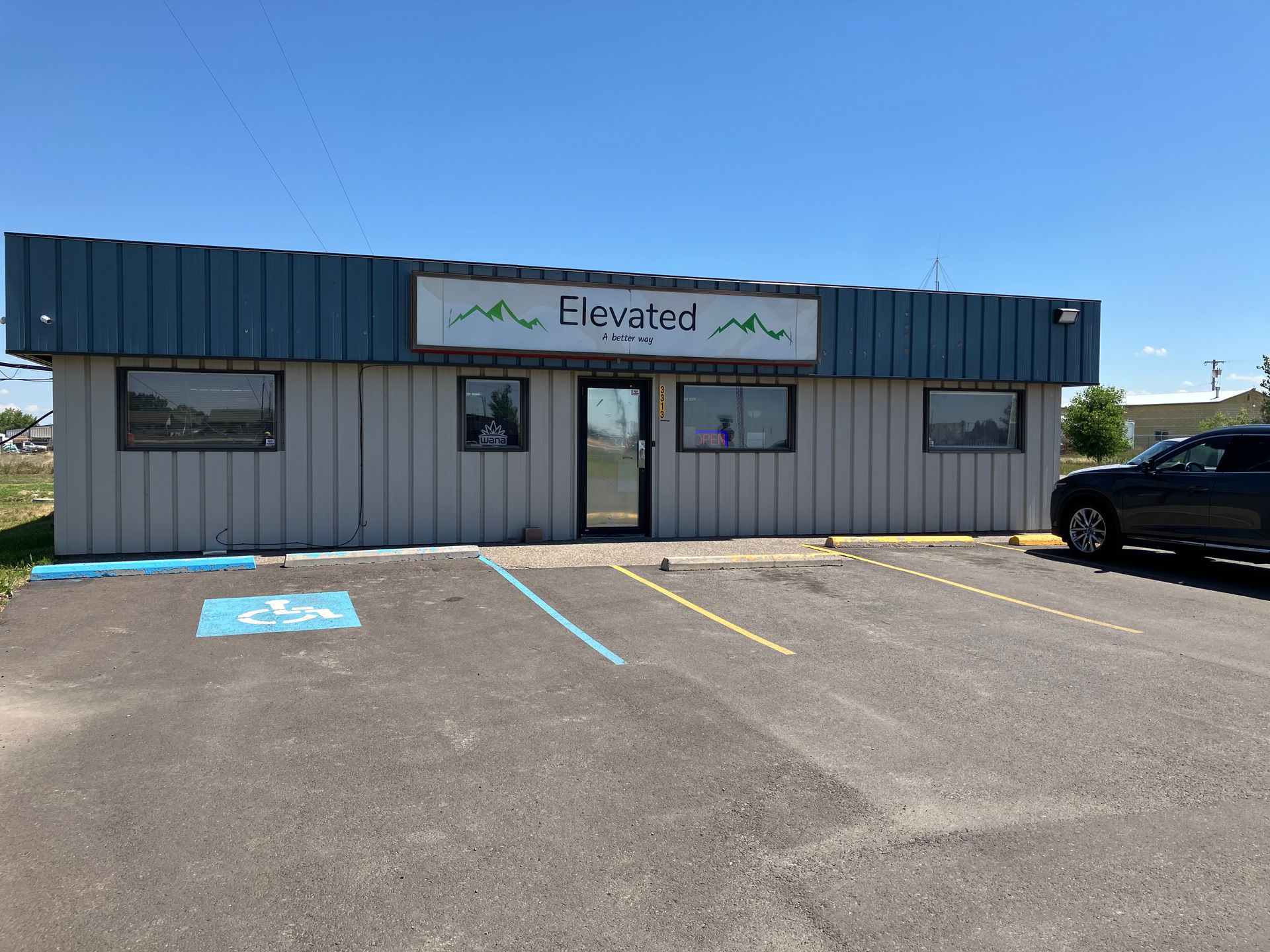 Exterior of Elevatec building with a handicap parking spot.