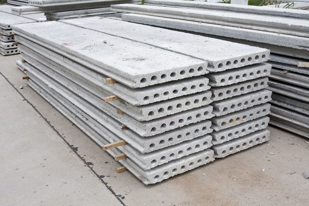 A Stack Of Concrete Slabs Sitting On Top Of Each Other On The Ground — Lonnie Henderson Concreting In Parkes, NSW