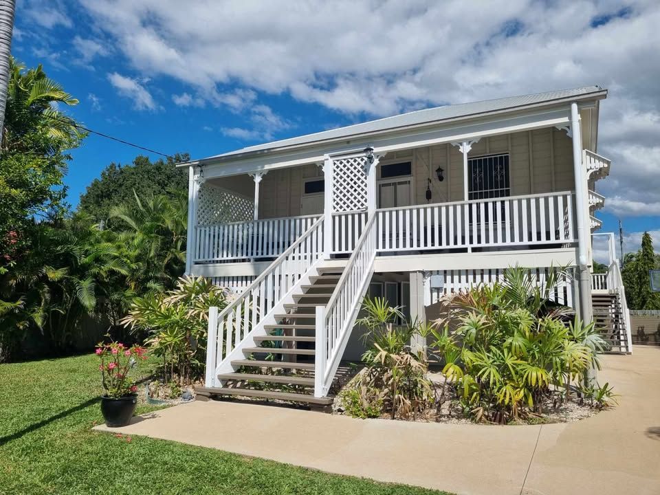 Two-story White House With Porch and Stairs — Israel Jones Painting in Vincent, QLD