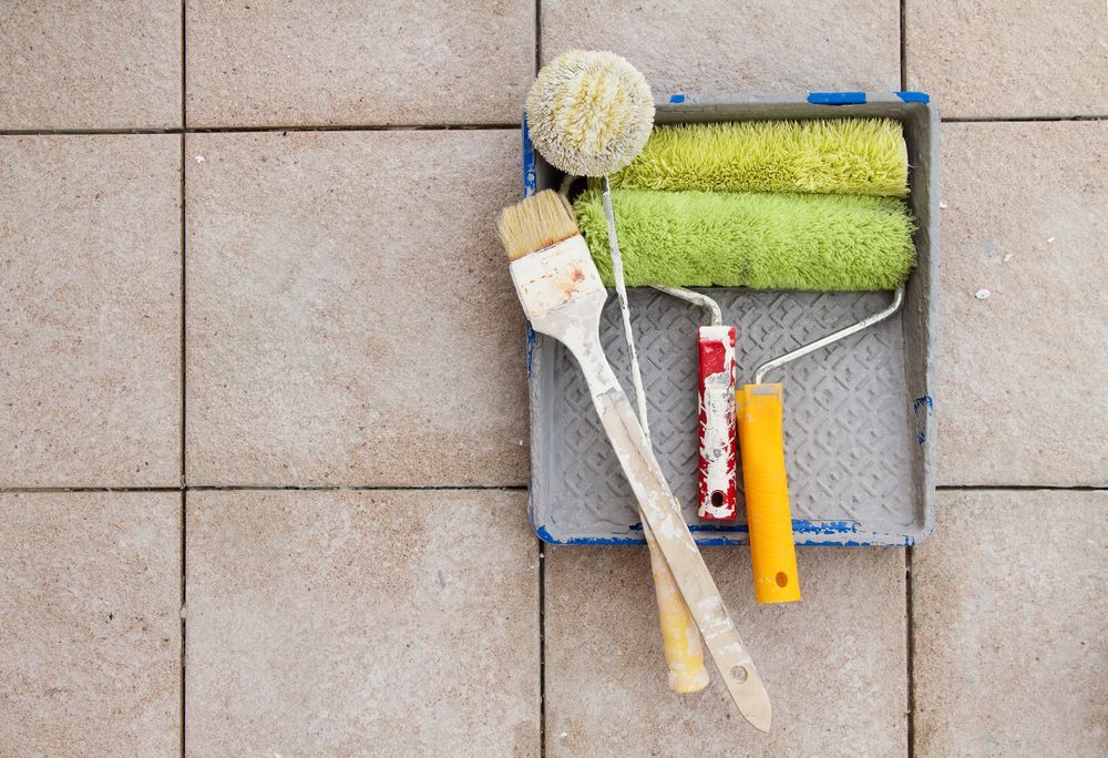 Paint Rollers, Brush, and Sponge in Tray on Tiled Surface — Israel Jones Painting in Pallarenda, QLD