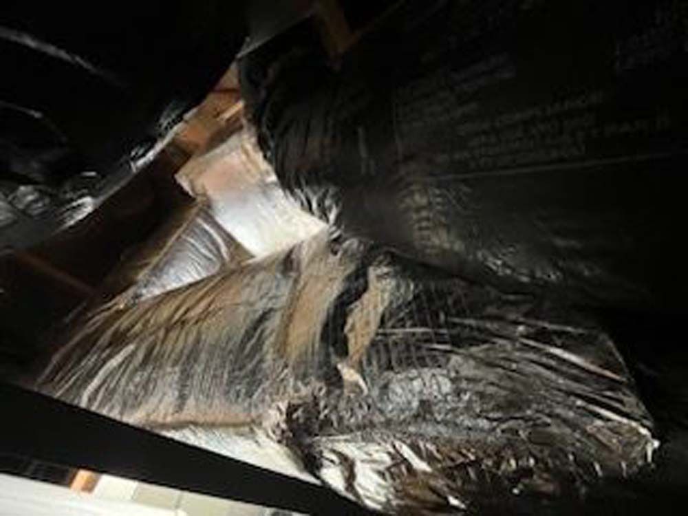 A bunch of plastic bags are sitting on top of each other in a room.