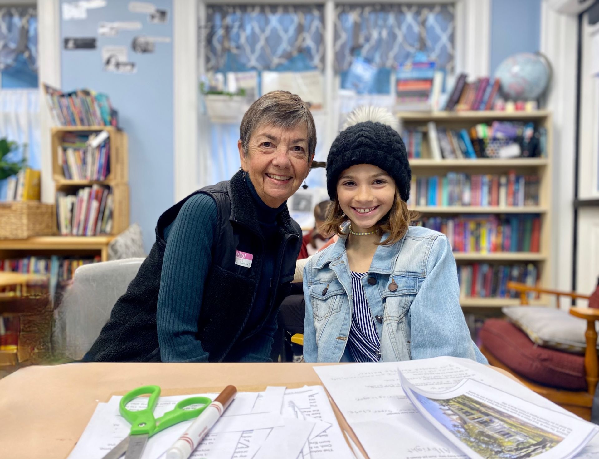 A smiling grandmother with her granddaughter.