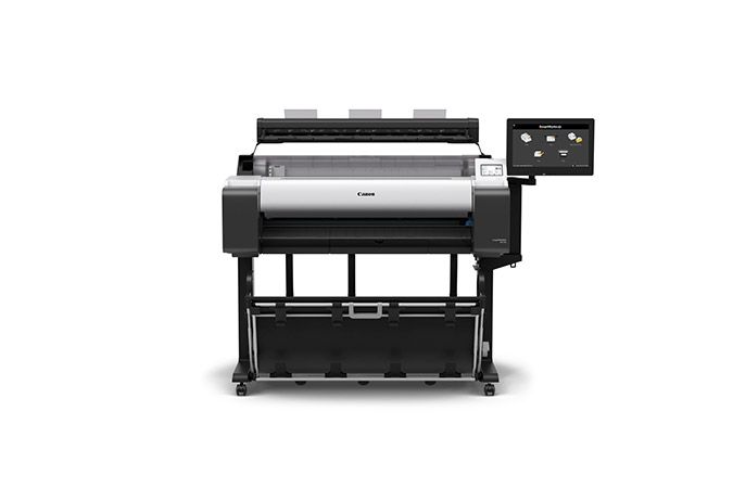 Wide-format Canon printer on a black stand, with a control screen.