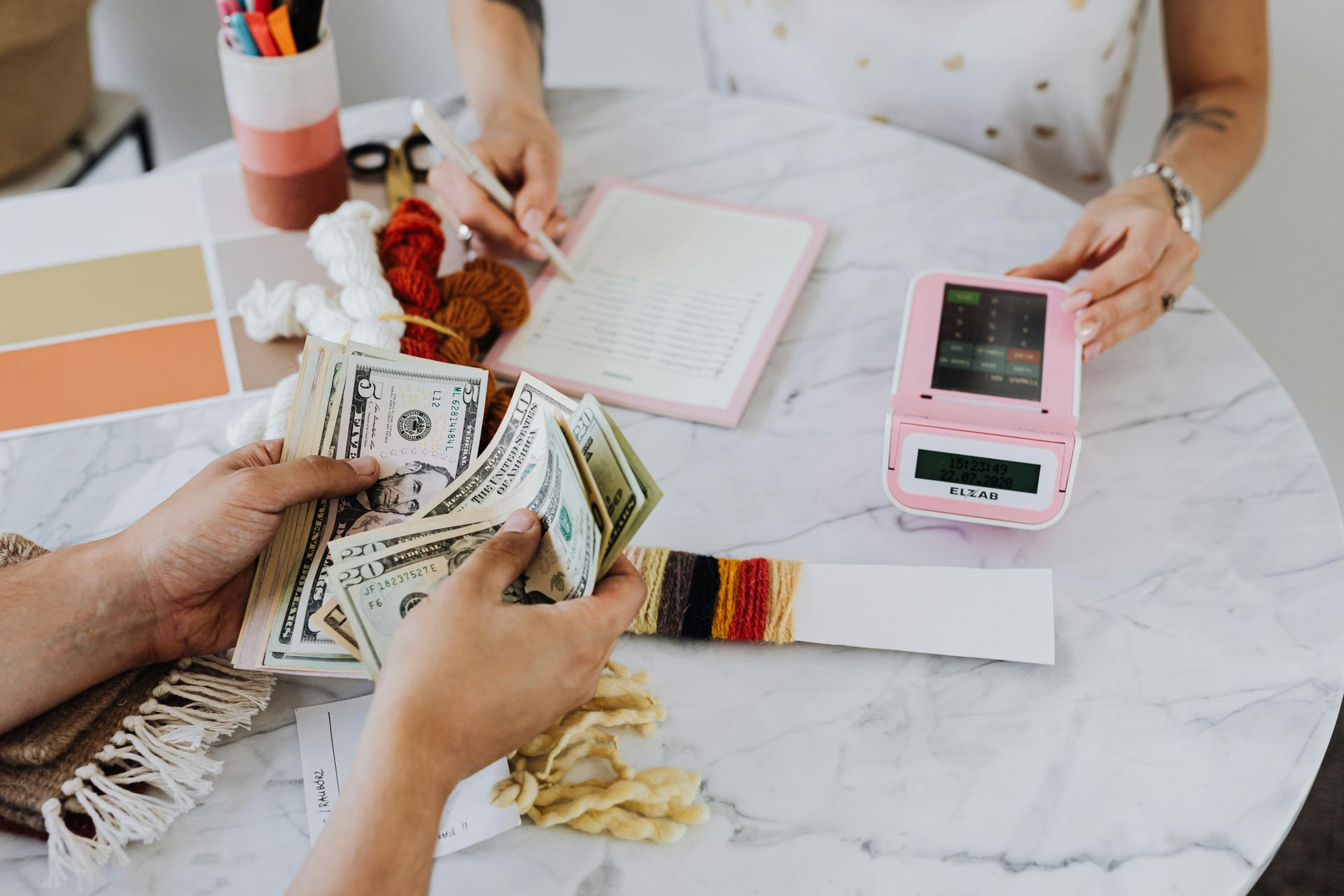 Two people budgeting and counting money.