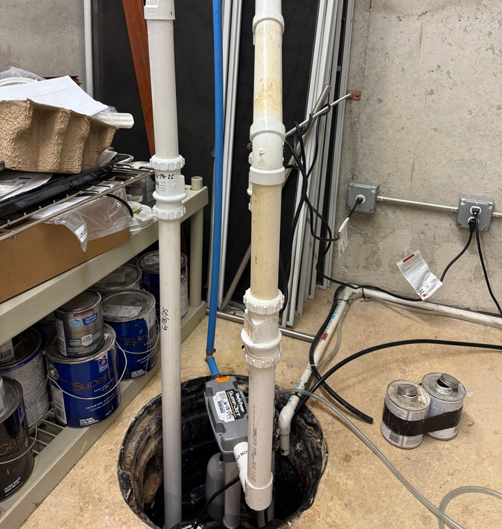 Licensed technician providing plumbing services in a residential home.