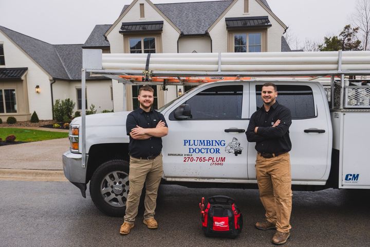 Licensed technician providing plumbing services in a residential home.