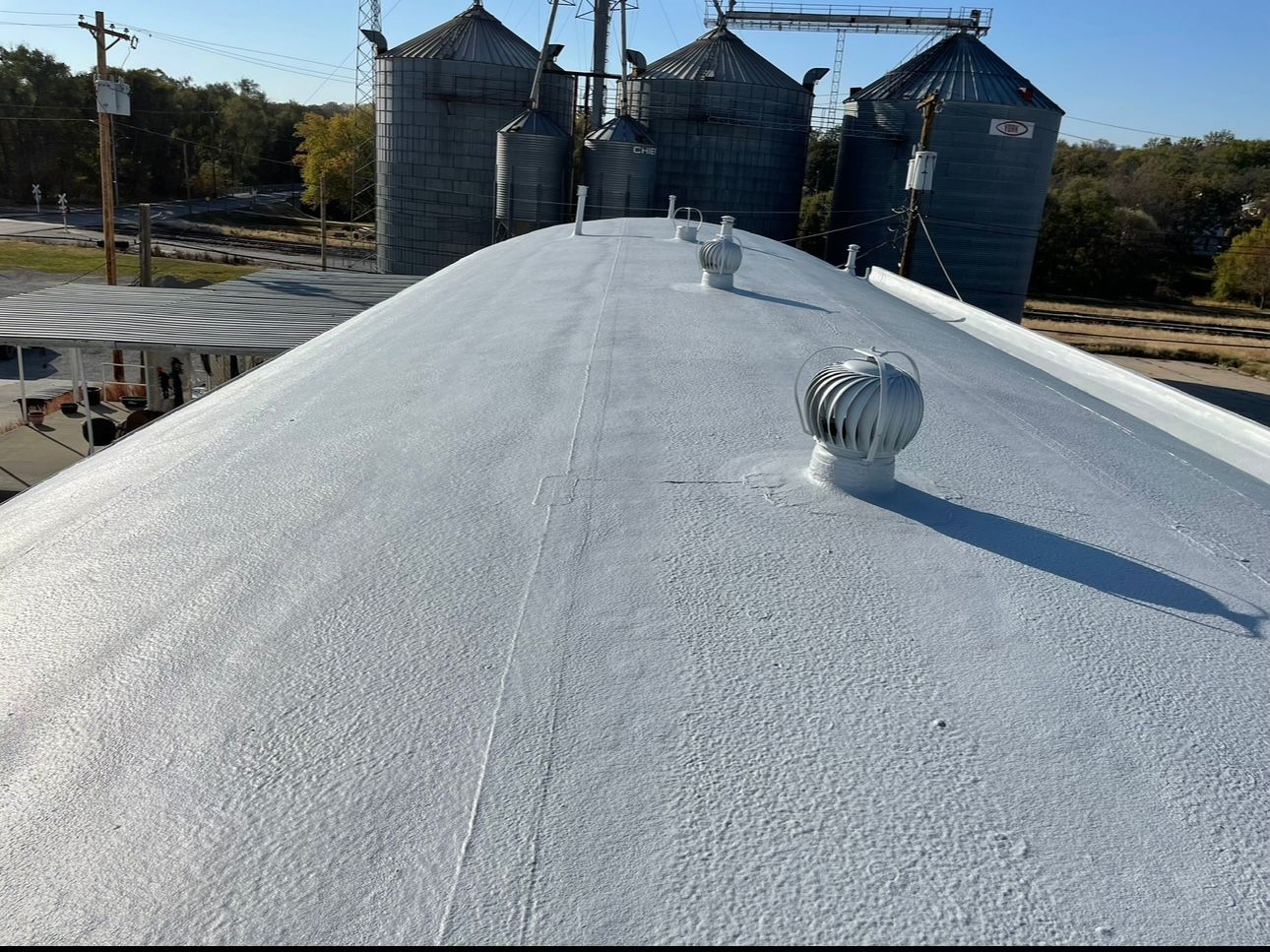 Man Is Carrying Roll of Insulation — Nebraska City, NE — Midwest Custom Coatings